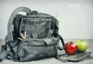 Still Life With An Old Backpack, Books And Apples