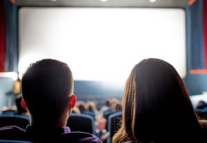 Group of people at the cinema watching a movie