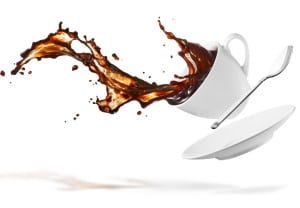 cup of spilling coffee creating splash