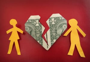 paper couple on broken dollar heart