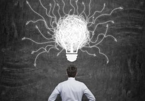 businessman and drawing bulb with arrows over head