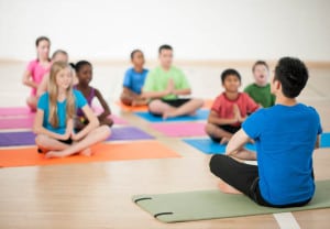 Diverse kids yoga class