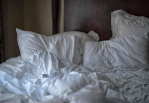 Empty messed up bed in a hotel room