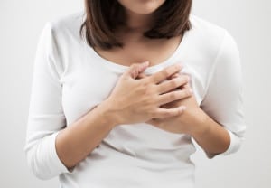 Woman having a pain in the heart area