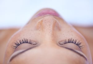 Cropped shot of an attractive young woman lying on her back