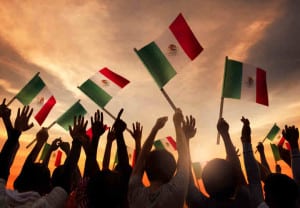 Group of People Holding National Flags of Mexico