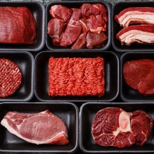 Different types of meat in plastic boxes packaging tray